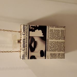 Ruby Collection Newsprint Clutch with Gold Shoulder Strap & Acrylic Turn Lock